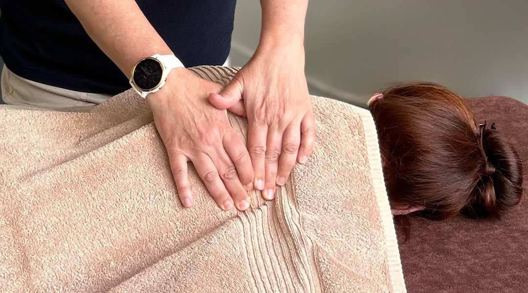 Helen applying a Bowen treatment